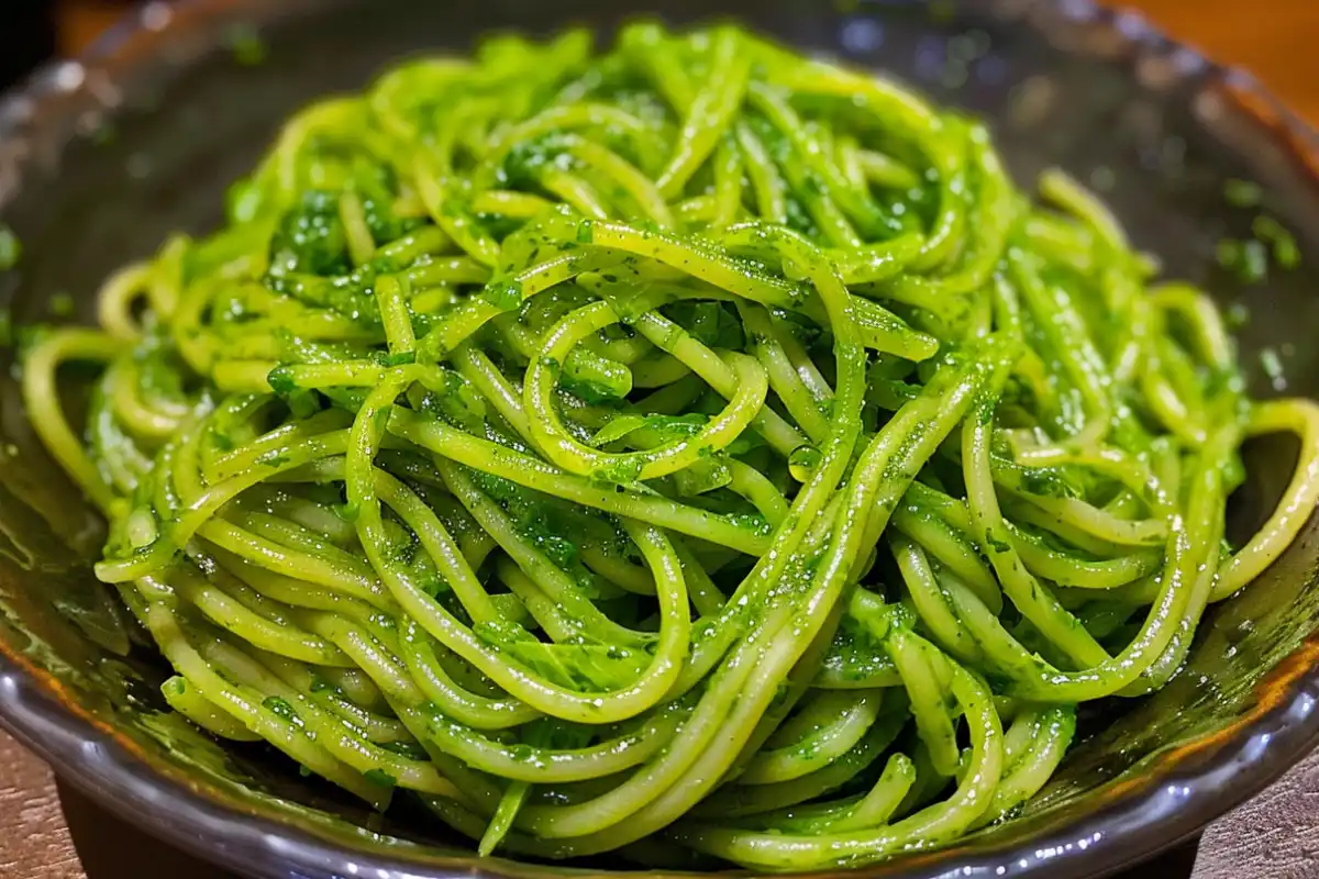 Green spaghetti paired with grilled chicken and roasted vegetables.