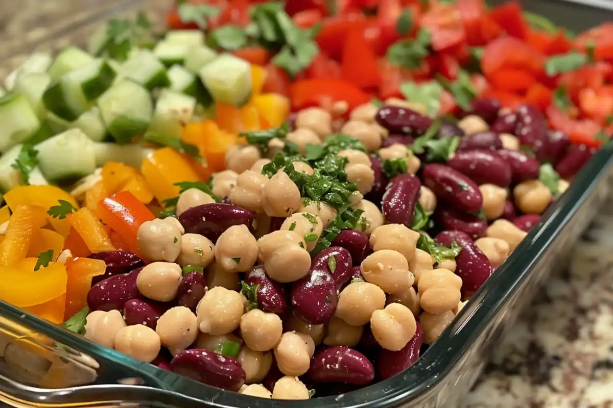 Dense bean salad in a bowl with colorful vegetables